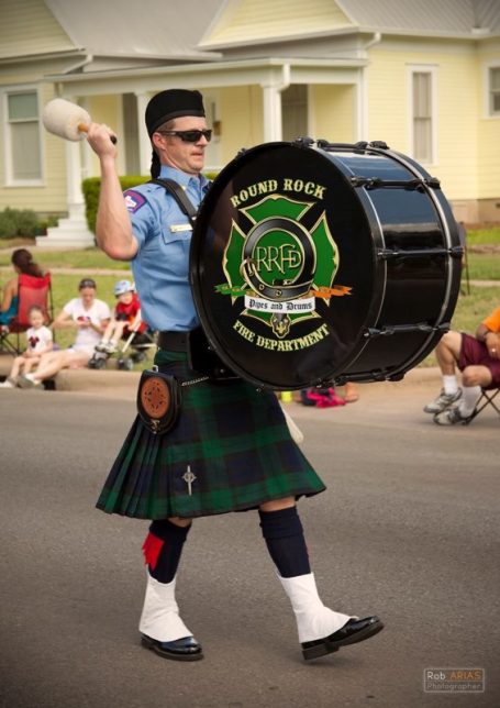 John playing drum, marching in uniform